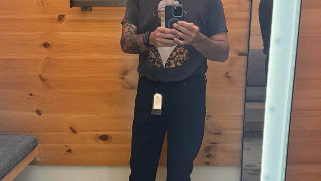 Sean conducting denim fieldwork in a fitting room