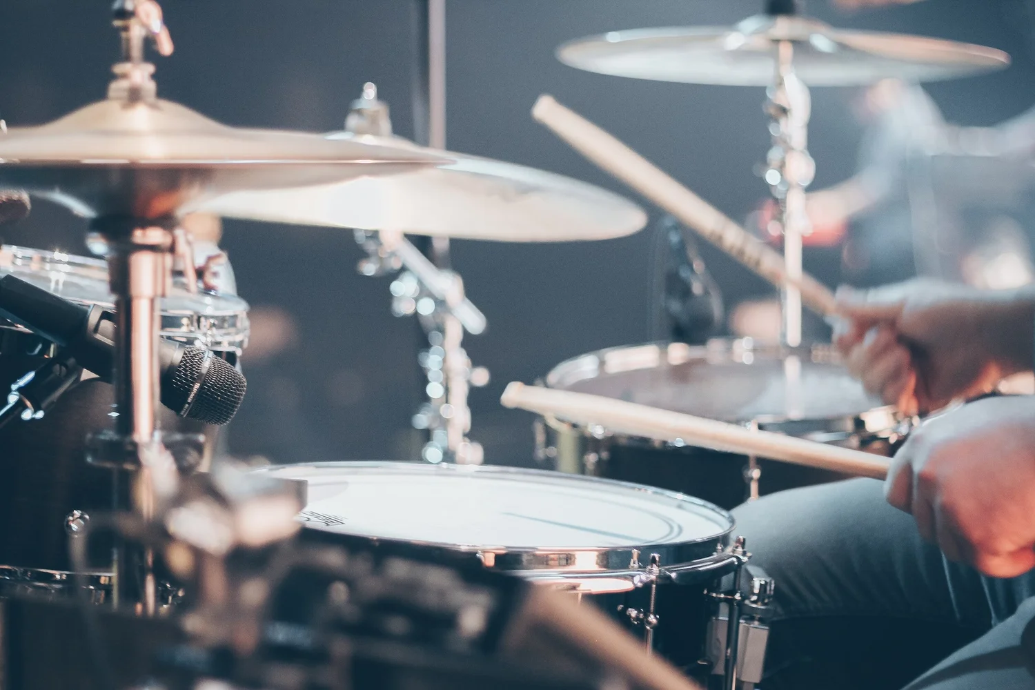 Close-up of cymbals, drums and a drummer’s hands